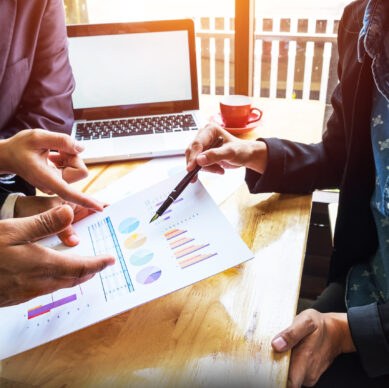 Business team working on a new business plan with modern digital computer